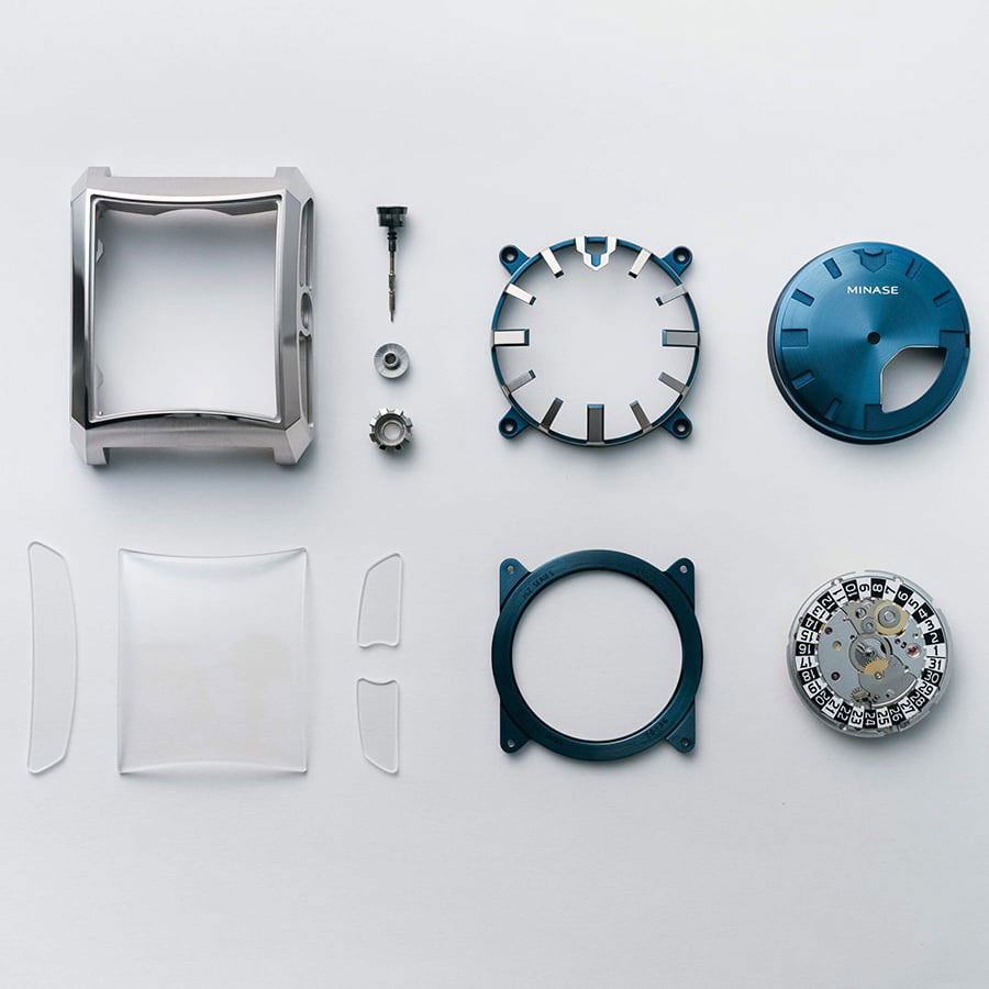 Vue éclatée des composants d’une montre Minase avec boîtier, verres, cadran et mouvement